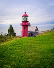 Fototapeta na wymiar red lighthouse in Gaspe, Quebec 