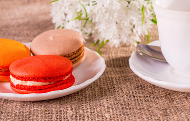 Cup of coffee and a bouquet of white flowers