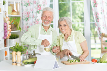 senior couple preparing dinner