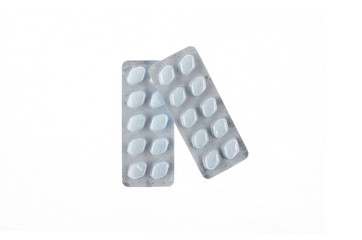 two plates of blue pills on white isolated background