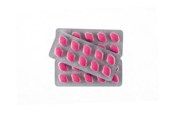 three plates of red pills on white isolated background