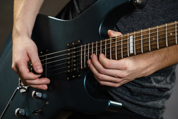 Fototapeta premium Male hands playing electric guitar