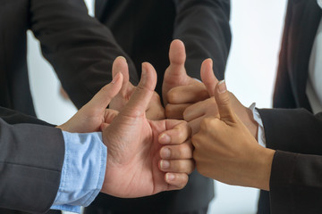 Close up Group business people of hands making give thumbs up sign teamwork. Support together successful Concept.