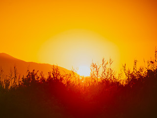 Sunrise over mountain hill