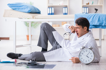 Sleepy doctor tired after long night shift