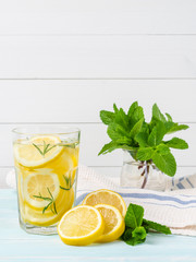 Detox citrus infused flavored water. Refreshing summer homemade cocktail with lemon. Fresh lemon and lemonade