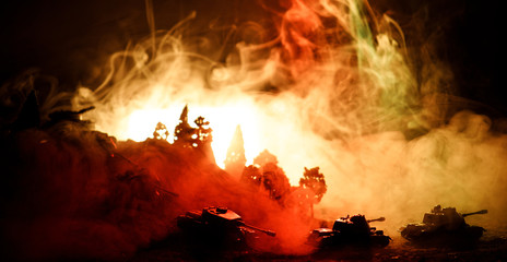 War Concept. Military silhouettes fighting scene on war fog sky background, World War Soldiers Silhouettes Below Cloudy Skyline At night. Attack scene. Selective focus Tanks battle. Decoration