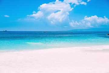Tropical white sand beach and blue ocean in Bali