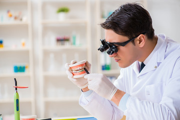 Young dentist working in the dentistry hospital