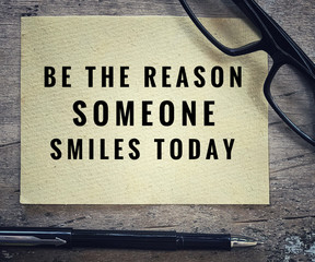 Motivational and inspirational quotes - Be the reason someone smiles today. With blurred styled...