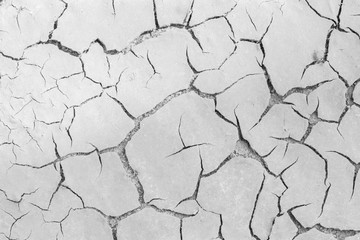 Soil drought cracks texture white background for design.