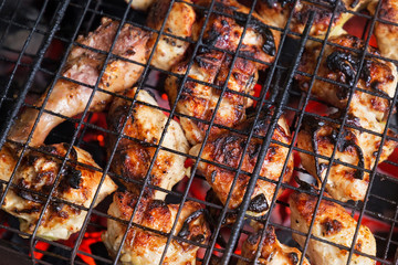 Barbecue from chicken meat on the grill.