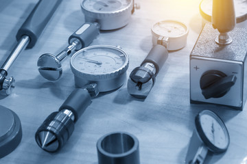 The  dial gauge for industrial measuring purpose in the light blue scene.