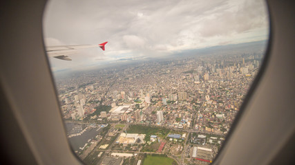 Fototapeta na wymiar View from the window of the plane to the city of Manila. Philippines.