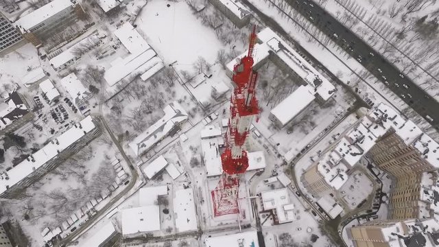 amazing drone flight over a modern telecommunication tower, buildings and roads
