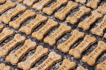 Dog biscuits on black background