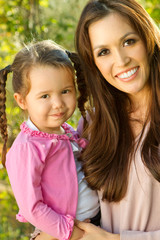 Fototapeta na wymiar Beautiful Hispanic woman with her daughter.