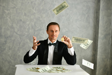 Concept Very wealthy businessman. Businessman is happy with his money.A businessman showing his...