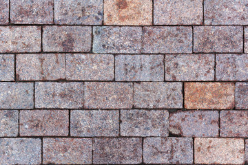 Obraz premium Grey granite paving stones close-up. Texture of natural granite