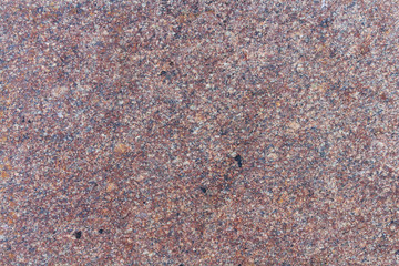 Red granite slab close-up. Texture of natural stone