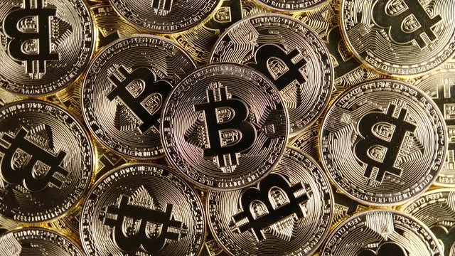 TOP VIEW: Rotating bitcoins - Close up
