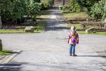 Little girl with a choice lost at the crossing