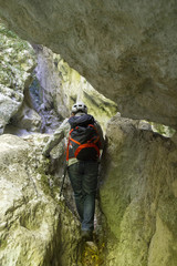 Obraz premium hiker in narrow gorge canyon at matese park gola del torano