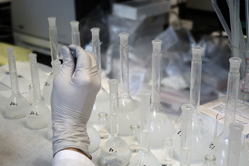 A working day in chemical laboratory: a assistant prepares samples for analysis