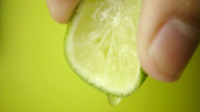 A lime squeezed in slow motion - Close-up
