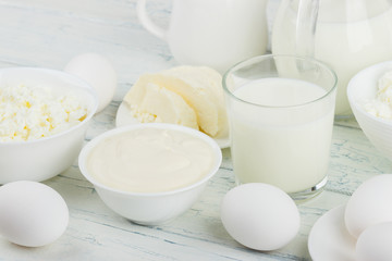 Different dairy products on the wooden background