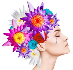 Beautiful woman with blooming flowers on her head.