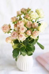Bouquet of pale pink roses in a vase. Beautiful Holiday background. 