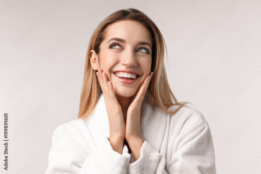 Sticker Beautiful young woman with silky skin on light background