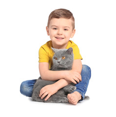 Cute little child with cat on white background