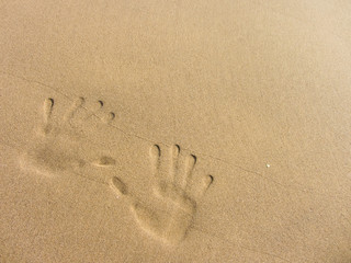 playing with sand long the shoreline