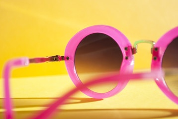 glasses. rose-colored glasses on a yellow background