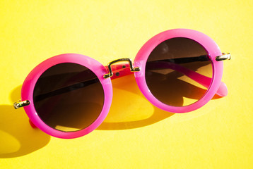 glasses. rose-colored glasses on a yellow background