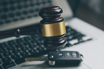 cyber law or crime internet concept. judges gavel on keyboard laptop computer.