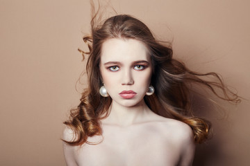 Naklejka premium Sexy young blonde girl hair jewelry on her neck and earrings in her ears, beautiful eyes. Summer skin care eye shadow, fashion natural skin care, face skin art, body beauty nature, spring makeup