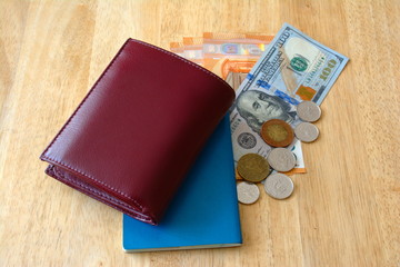 Dollars, euros, passport, coins, wallet. Isolated. Prepare for travel.