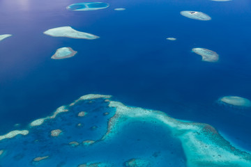 Fototapeta na wymiar Aerial view of Maldives atolls is the world top beauty. Maldives tourism.