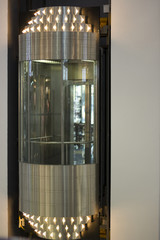 Modern glass elevator in the mall. Close-up