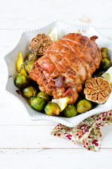 Baked turkey roll with Brussels sprouts, garlic, thyme and lemon