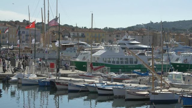 Raw boats and yachts moored in a port 