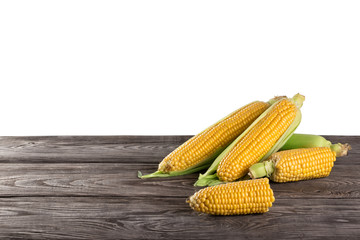 Yellow fresh corn on wooden table