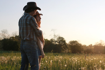 Cute couple on a walk by the countryside