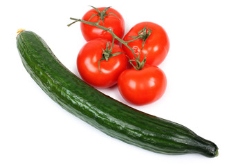 Green cucumber and red tomatos on white background