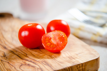 cherry tomatoes on wooden stong