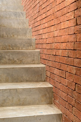 Concrete Staircase with brick wall in residential house building of construction industry