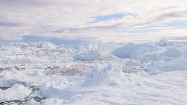 Greenland Iceberg landscape of Ilulissat icefjord with giant icebergs. Icebergs from melting glacier. Arctic nature.